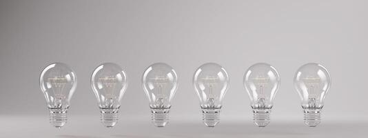 Floating Transparent Lightbulbs on Minimalist Grey Background photo
