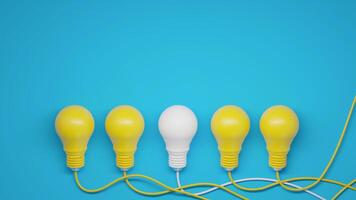 White Lightbulb Standing Out Among Yellow Bulbs photo