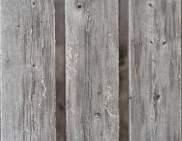 Weathered gray wooden planks, showing age and texture. photo