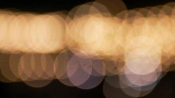 Mesmerizing bokeh effect created by out of focus lights glowing beautifully against a dark background. This dreamy, atmospheric aesthetic is often used. photo