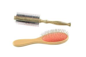 Two essential brushes one with black bristles and another with wire bristles are cut out on a white background. Together, they symbolize versatility in cleaning photo