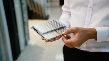 Salesman holding a sample palette, prepared to guide customers in selecting the best tiles for their projects video