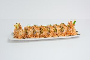 Shrimp breadcrumb filled tamago, cucumber pickle sushi roll with teriyaki sauce photo