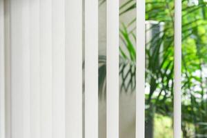 Modern vertical fabric blinds on the window photo