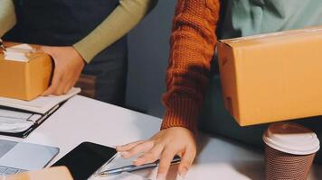 People holding boxes and laptops at a desk video