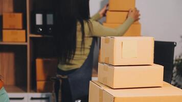 A woman is putting boxes on a desk video