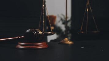 Judge's gavel and scales of justice on a desk video