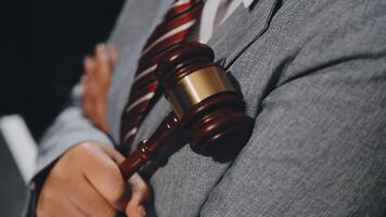 A judge holding a gavel in his hand video