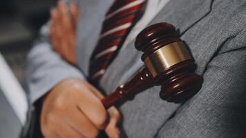 A man in a suit holding a gavel video