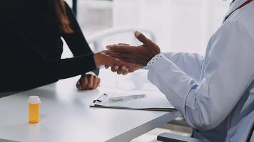 A doctor shaking hands with a patient video