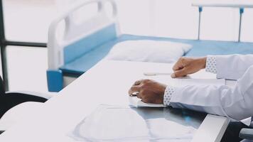 A doctor is writing on a piece of paper video