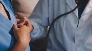 A doctor is checking the heart rate of a patient video