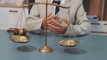 A man in a suit is holding a scale with two scales video