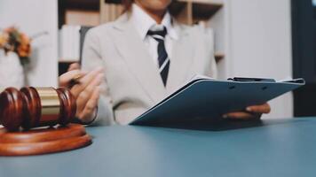 Lawyer in office with gavel and papers video