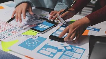 A person is using a smartphone to design a website video