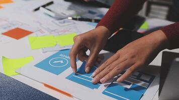 A person is working on a laptop with a piece of paper on it video