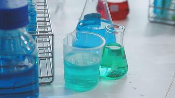A laboratory with several colorful liquid containers video
