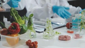 A scientist in a lab with a variety of food video