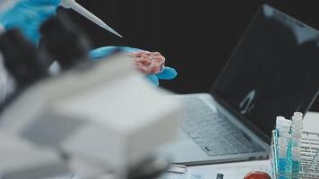 A person in a lab coat is holding a piece of food video
