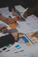 A group of people working on a design project photo
