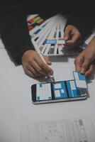 A person is using a phone to design a website photo
