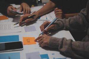 People working on a project at a table photo