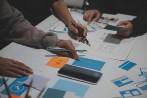 People working on a design project at a table photo
