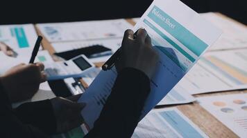 A person is holding a piece of paper with a graph on it video