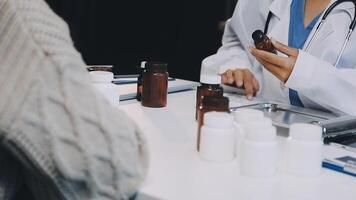 A doctor is examining a bottle of pills video