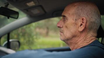 Elderly Man Waits In Traffic In The Car Singing A Song On The Radio video
