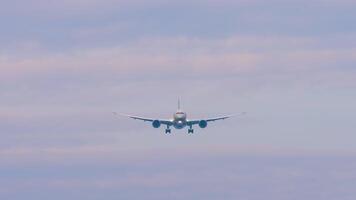 Passenger unknown plane approaching landing. Plane in the sky, front view video