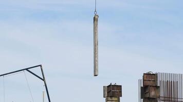 Crane depositing a module of a building under construction video