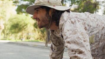 Soldier Crawls On The Ground And Smiling Approaches A Kitten To Save It video