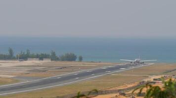 Long shot of a passenger wide-body jet with an unrecognizable livery on the runway, ready for takeoff video