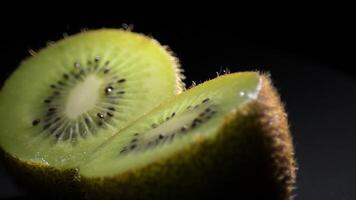 Kiwi fruit sliced in half spinning video