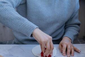 Workshop cutting figures Creator is using white air dry clay for making decor to Christmas tree holiday. Creating hobby recreation activity that involves fingers. DIY crafting Modern art photo
