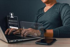 A man protects personal data on a laptop with virtual screen interfaces, symbolizing cybersecurity and privacy concepts. The scene features a lock icon and internet network security technology. photo