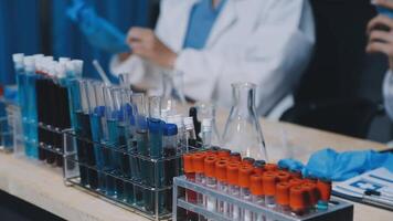 A lab technician is working in a lab video