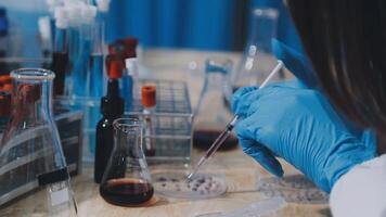 A person in a lab coat is working on a project video