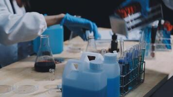 A person in a lab coat is working on a table video