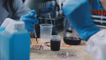 A person in a lab coat is working on a project video