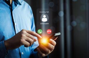 Close Up of a Man Receiving an Incoming Call from an Unknown Number on a Smartphone with Bright Notification Icons, Highlighting Communication, Technology, and Privacy Concerns photo