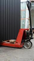 Modular house is prepared for sending. Prefabricated wooden home on manual forklifts. Vertical video