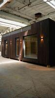 Modern mobile prefabricated modular home at a construction site. Vertical video