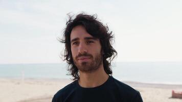 Man Makes A Slight Smile Of Approval Thinking About His Success On The Beach video