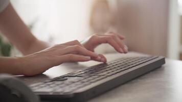 Hands Typing on Wireless Keyboard in Home Office Setting video