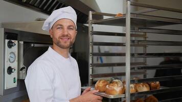 Portrait of a baker in bakery with bread video