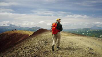 Man Hiking In Mountains, Admiring Beautiful Scenery From Mount Top, Back View, Slow Motion video