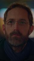 A Portrait of a Thoughtful and Reflective Man Wearing Glasses and Sporting a Beard video
