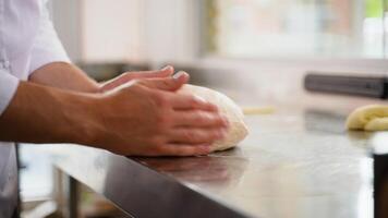 Baker chef is making with flour loaf of dough for preparation of pasta or pizza video